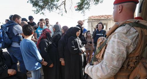 Russian centre for reconciliation of opposing sides in Syria distributes humanitarian aid in Holmes, Syria. Photo: http://мультимедиа.минобороны.рф/multimedia/photo/gallery.htm?id=45027@cmsPhotoGallery