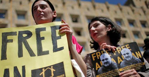 Participants of the rally in support of Afghan Mukhtarly hold banners with his portraits, Tbilisi, May 2017. Photo: REUTERS/David Mdzinarishvili