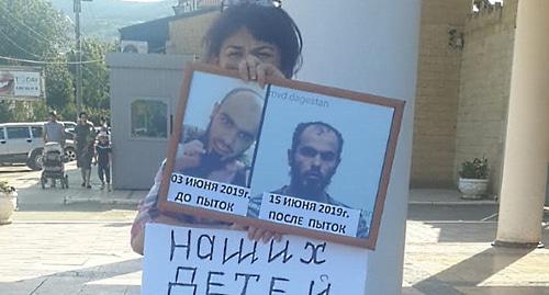 Zeinab Kurbanova holds solo picket at the Derbent City Police Department. Photo courtesy of Elena Barzukaeva