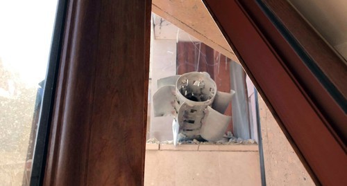 An unexploded ordnance stuck in a windowpane in home. Photo by Alvard Grigoryan for the "Caucasian Knot"