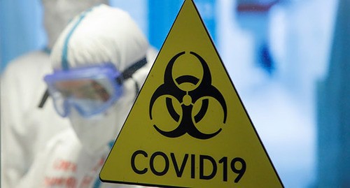 COVID-19 warning sign. Photo: REUTERS/Maxim Shemetov