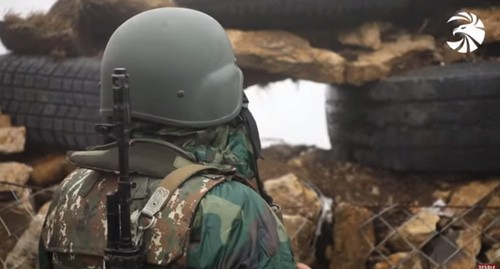 An Armenian soldier in the trenches. Screenshot of the video by ВООРУЖЕННЫЕ СИЛЫ MEDIA https://www.youtube.com/watch?v=FGXc0hWqj5M&amp;t=1s