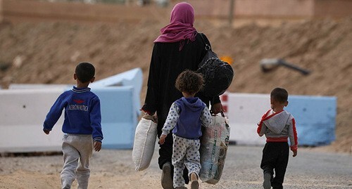 A woman with children in Syria. Photo:  REUTERS/ Rodi Said