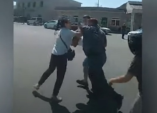 Security forces lead a protester in the Ararat region into a police minibus. Screenshot: https://news.am/rus/news/706794.html