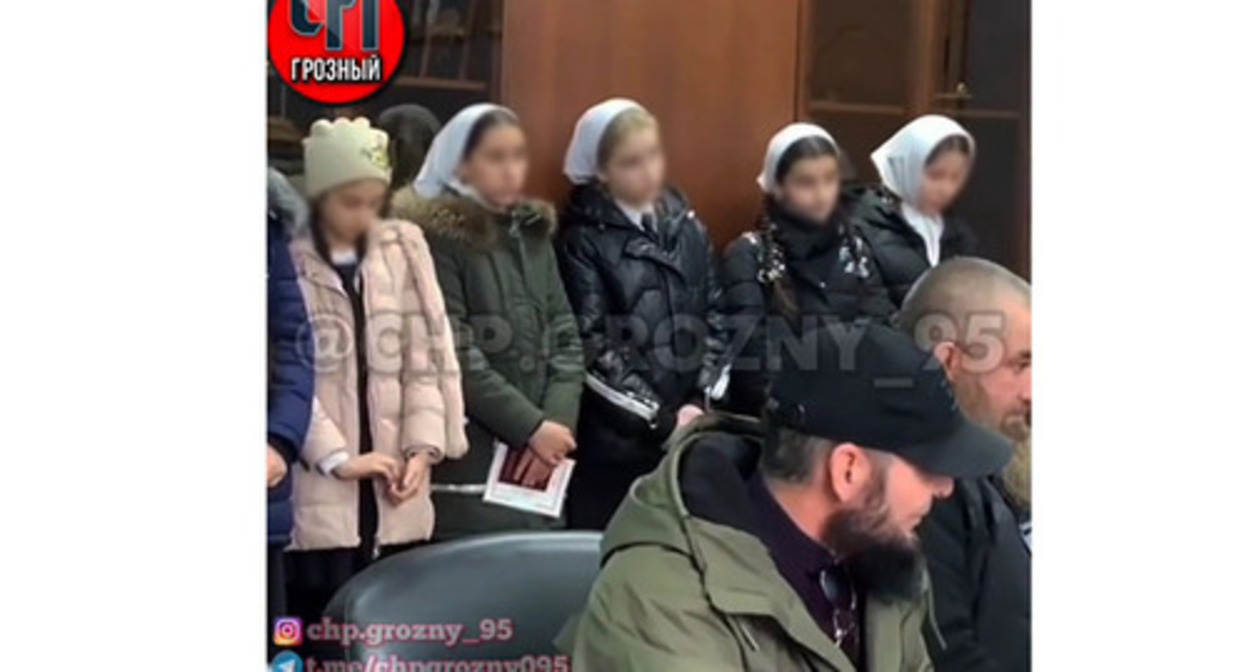 A still of the video, in which law enforcers were reprimanding six schoolgirls and their parents in the Urus-Martan District www.instagram.com/p/Cnz7rxY03pF ** the activities of the Meta Company, owning Facebook, Instagram, and WhatsApp, are banned in Russia