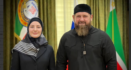 Khutmat Kadyrova with her father Ramzan Kadyrov. Screenshot of the photo from Adam Delimkhanov's Telegram channel, posted on March 15, 2023 https://t.me/adelimkhanov_95/2092