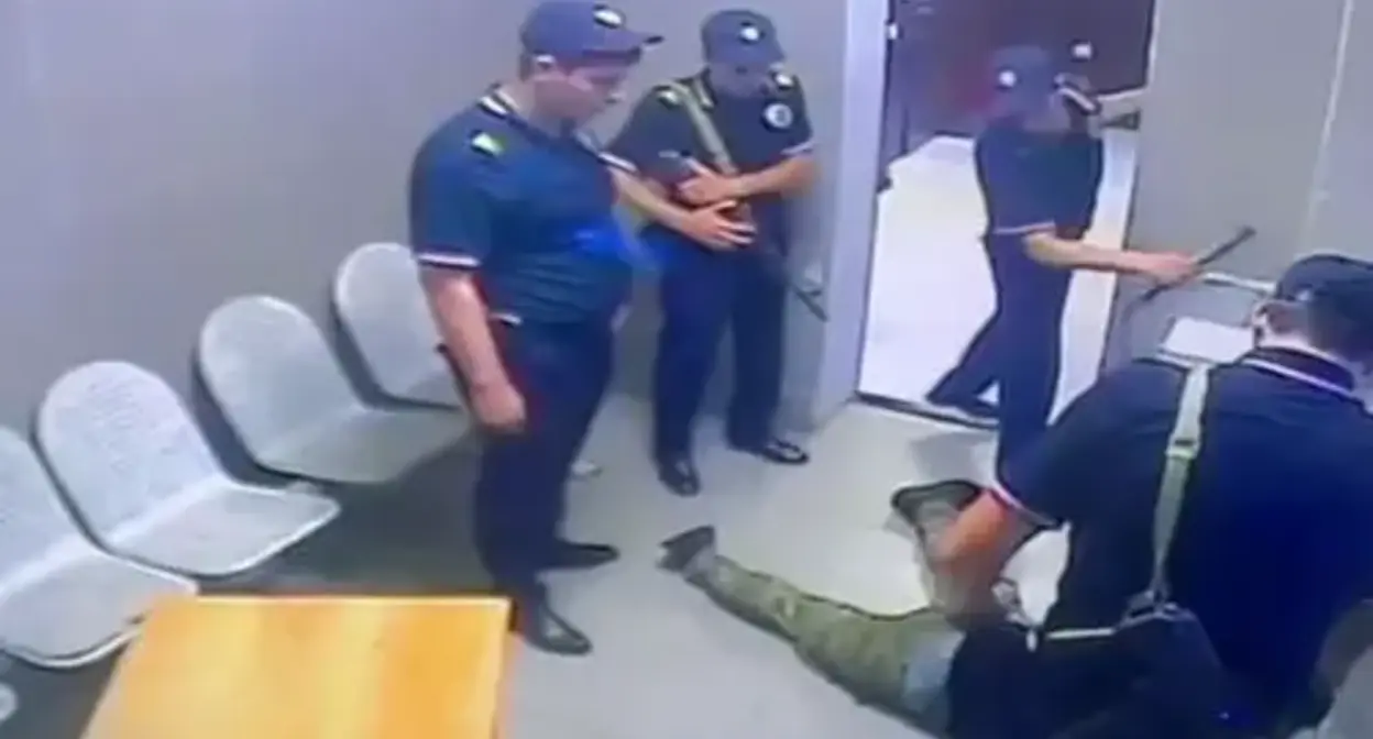 Law enforcers physically assault Akhmed Djabrailov, detained by police. Screenshot of a video by the Russian Ministry of Internal Affairs