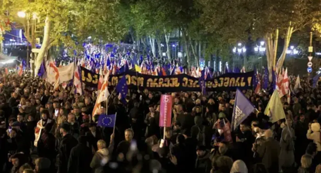 People at a rally holding posters calling for Georgia's European Union integration. Photo: Guram Muradov/Civil.ge