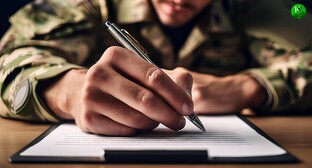 A soldier signs a contract. Picture made in Photoshop by the "Caucasian Knot"